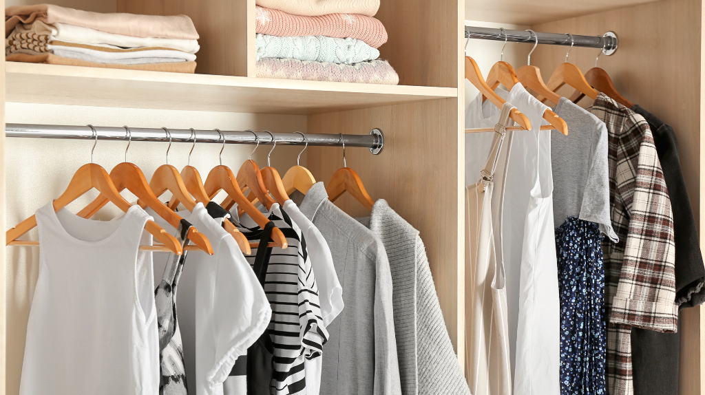 Freshly laundered clothes neatly hung in a wardrobe after following a regular washing routine