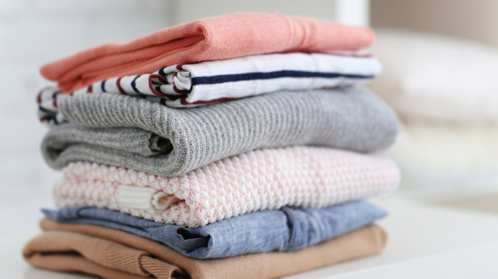 Clean and folded clothing showing the results of a well-timed laundry schedule