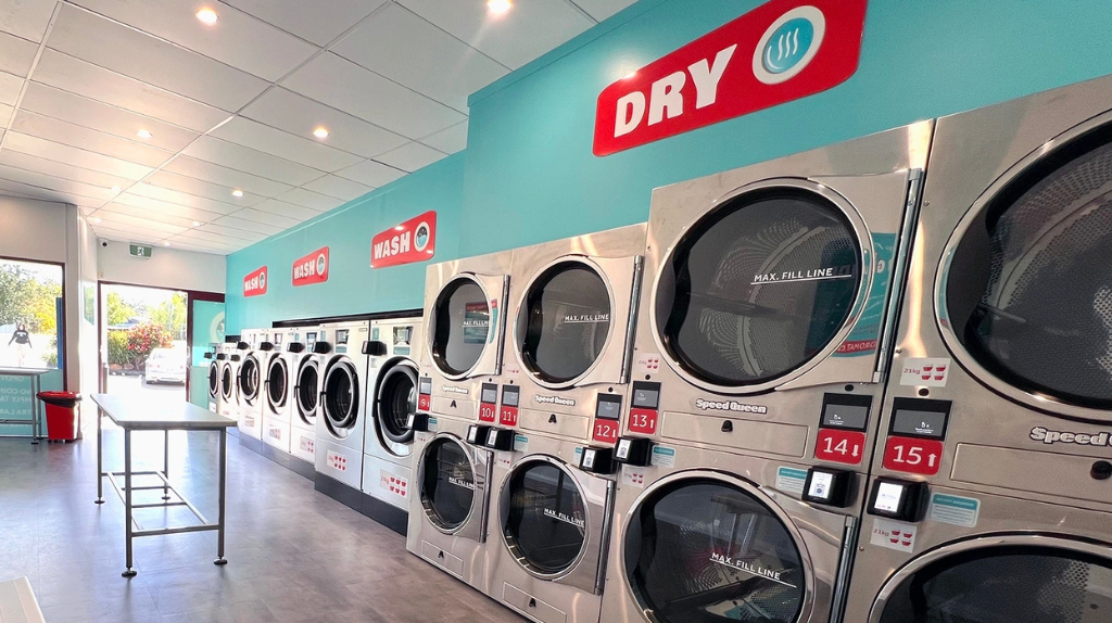 Speed-e Laundromat with high-capacity washers and dryers for quick and hygienic laundry solutions